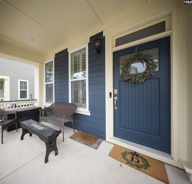 doorway to property featuring covered porch