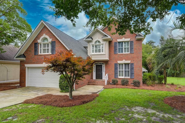 view of front of property with a garage and a front yard