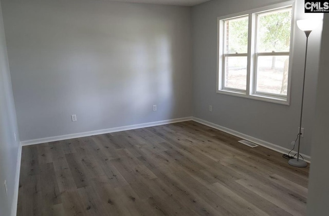 spare room with hardwood / wood-style flooring