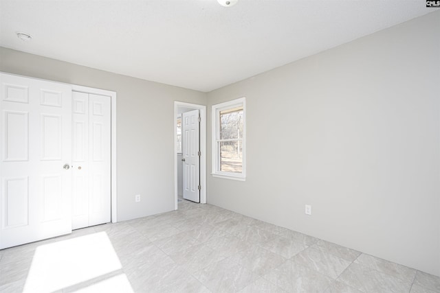 unfurnished bedroom with a closet