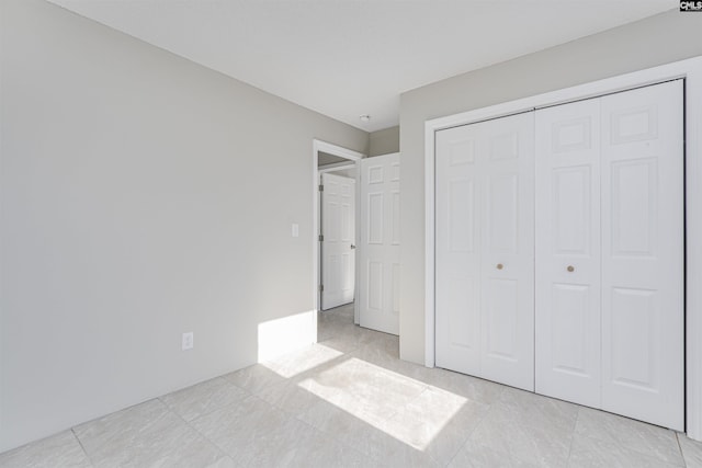 unfurnished bedroom featuring a closet