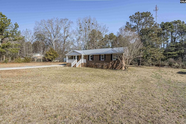 single story home featuring a front lawn and a porch