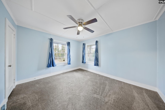 empty room featuring ceiling fan, ornamental molding, and carpet flooring