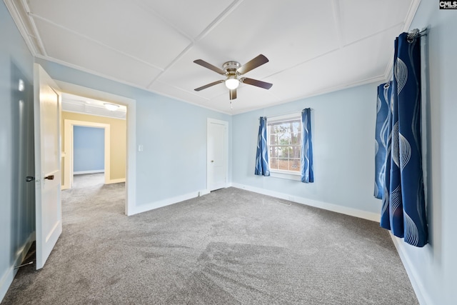 empty room with carpet flooring and ceiling fan