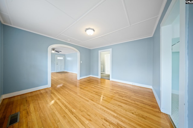 empty room with light hardwood / wood-style flooring and ceiling fan