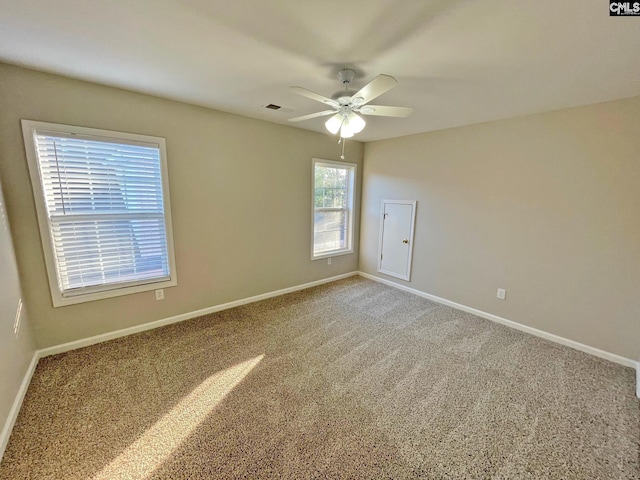 empty room with carpet floors and ceiling fan