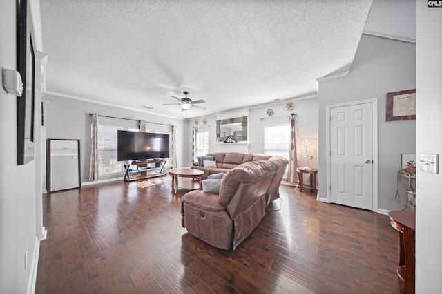 living room with crown molding, a textured ceiling, dark hardwood / wood-style floors, and ceiling fan