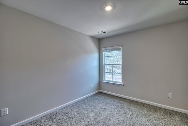 spare room featuring carpet flooring