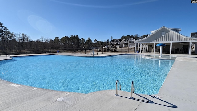 view of swimming pool featuring a patio area