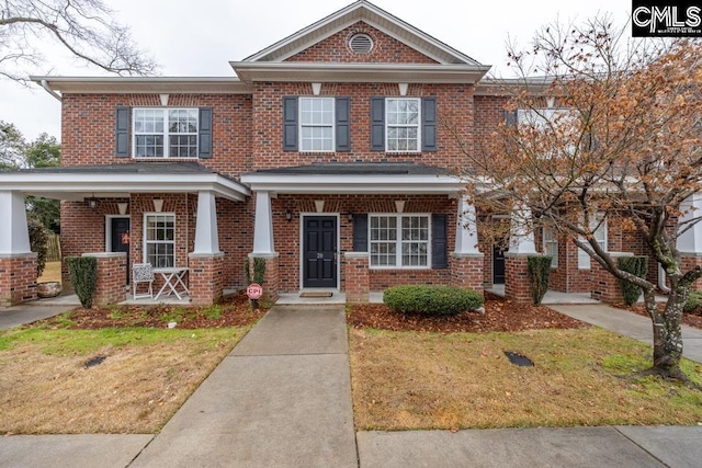 view of front of home with a front lawn and covered porch