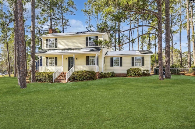 view of front facade with a porch and a front lawn