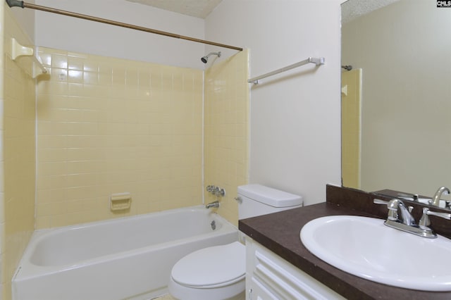 full bathroom with tiled shower / bath combo, vanity, a textured ceiling, and toilet