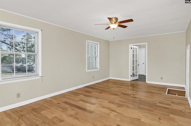 empty room featuring hardwood / wood-style flooring and ceiling fan