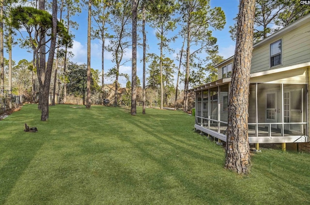 view of yard featuring a sunroom