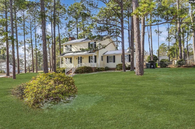 view of front of home featuring a porch and a front yard