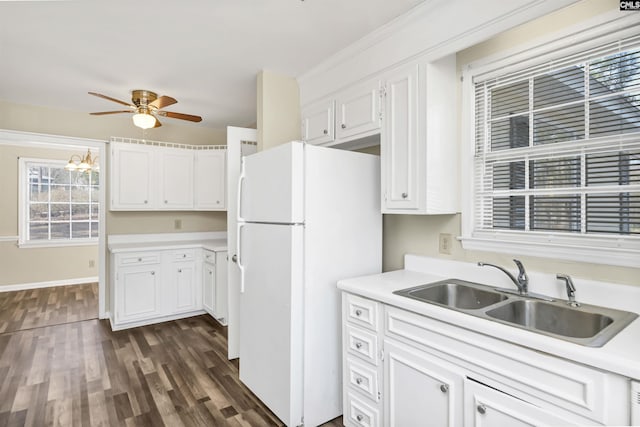 kitchen featuring sink, dark wood-type flooring, ceiling fan, white cabinets, and white fridge