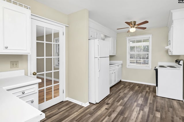 kitchen with ceiling fan, white appliances, dark hardwood / wood-style floors, and white cabinets