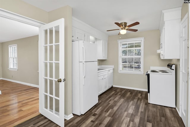 kitchen featuring white cabinetry, dark hardwood / wood-style flooring, ceiling fan, and white appliances