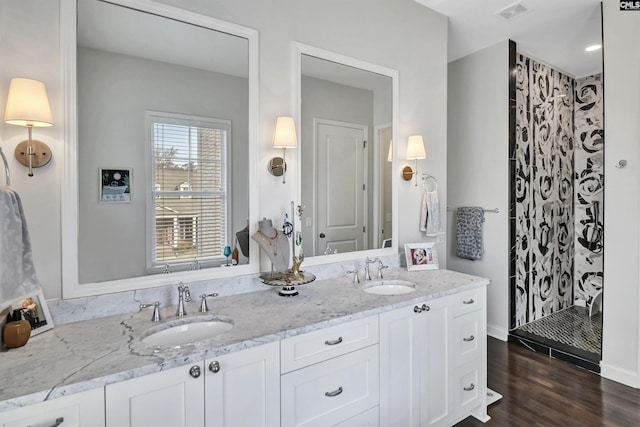 bathroom featuring vanity and wood-type flooring