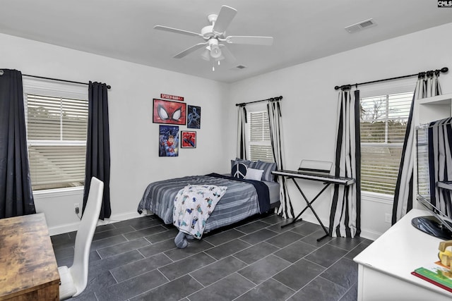 tiled bedroom with ceiling fan