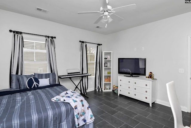 tiled bedroom with ceiling fan