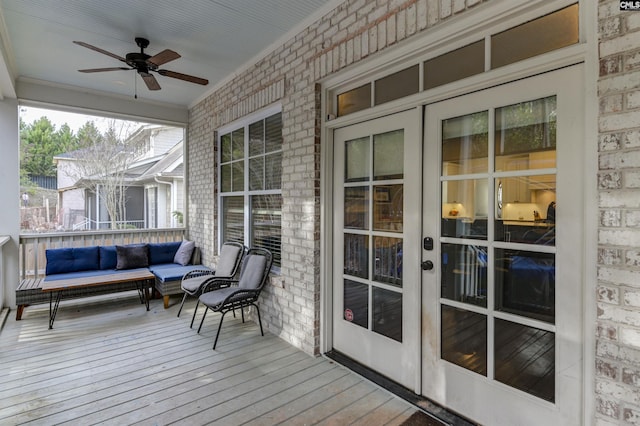 deck featuring an outdoor hangout area and ceiling fan