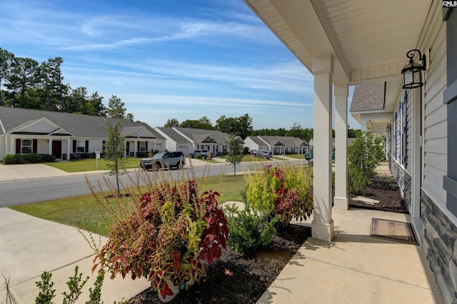 view of yard with covered porch