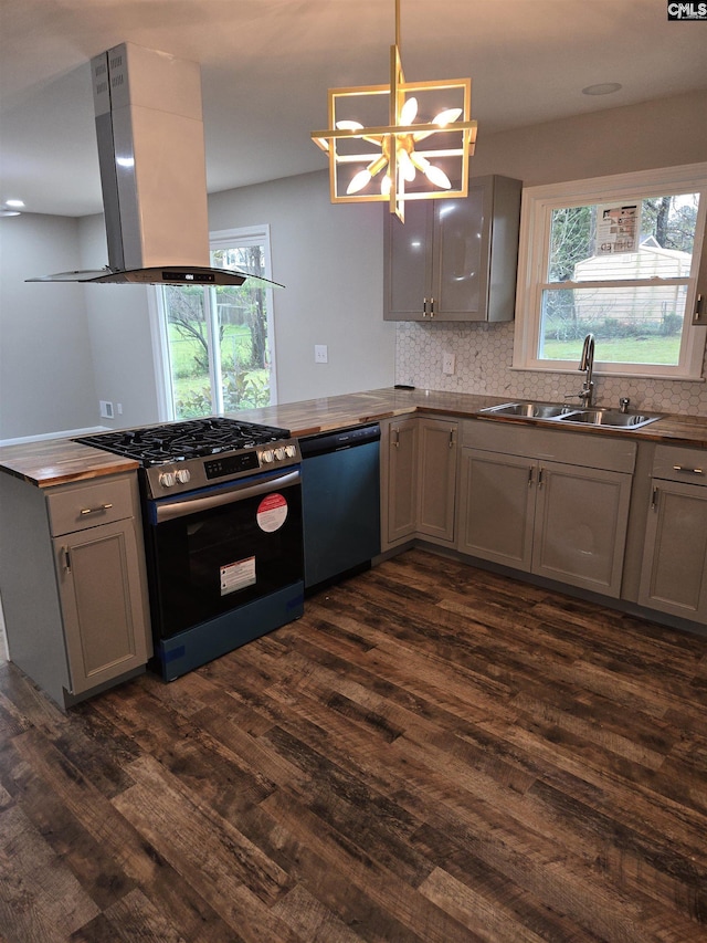 kitchen with pendant lighting, sink, gray cabinetry, stainless steel appliances, and island range hood