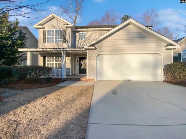 view of front of home with a porch and a garage