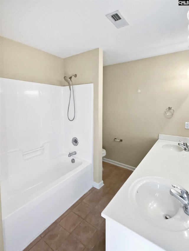 full bathroom featuring tile patterned floors, toilet, shower / bath combination, and vanity