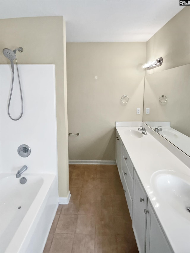 bathroom featuring vanity, tile patterned flooring, and shower / bathing tub combination