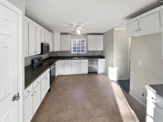 kitchen with sink, stainless steel appliances, white cabinets, and ceiling fan