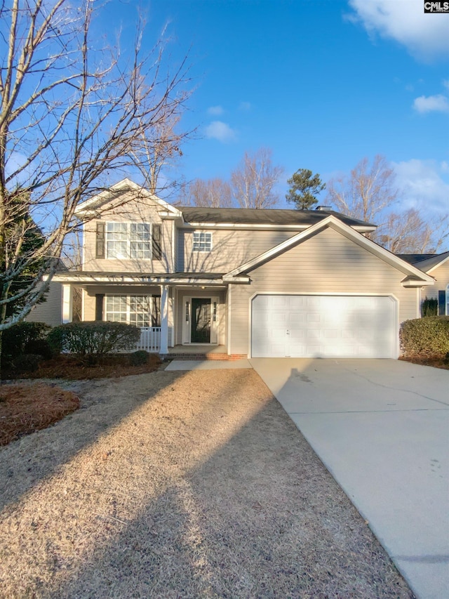 view of front property with a garage and covered porch