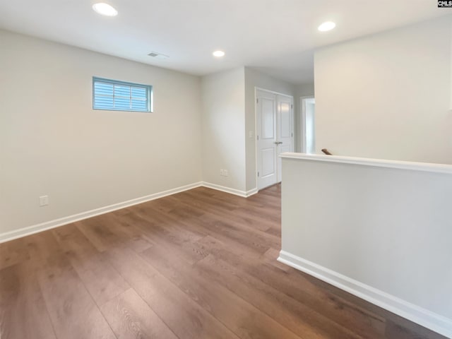 unfurnished room featuring wood-type flooring