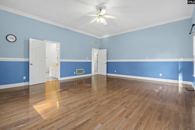 unfurnished room with ceiling fan, ornamental molding, and wood-type flooring