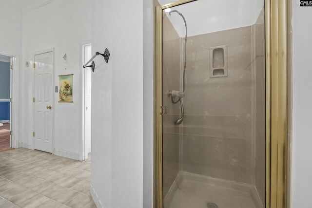 bathroom featuring walk in shower and ornamental molding