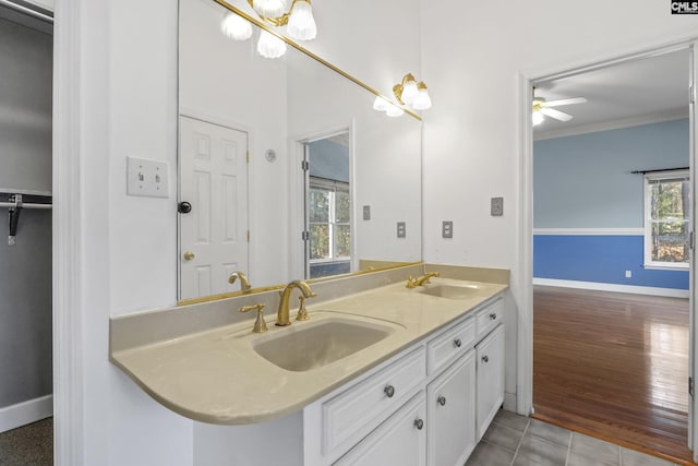 bathroom featuring vanity, crown molding, and tile patterned floors