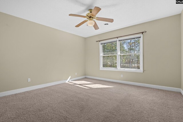 unfurnished room featuring carpet and ceiling fan