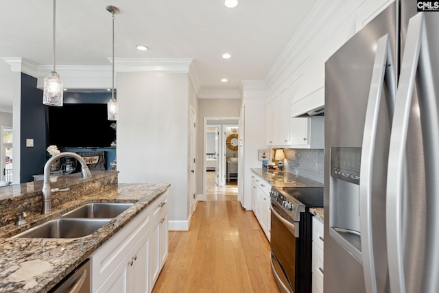 kitchen featuring sink, stainless steel appliances, and white cabinets