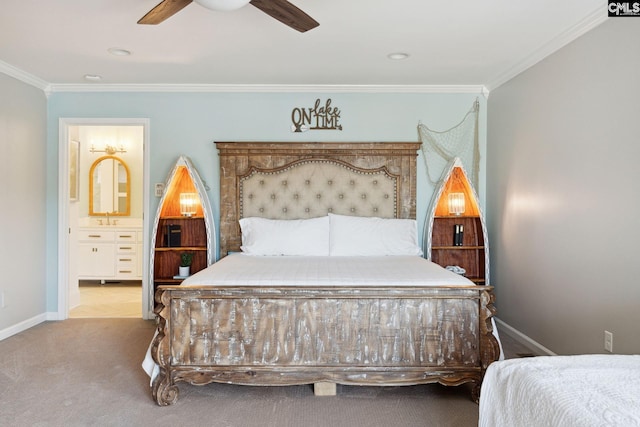 carpeted bedroom featuring sink, crown molding, ensuite bath, and ceiling fan