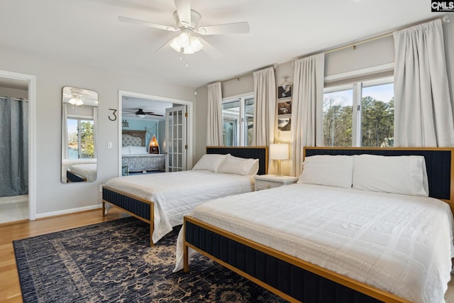 bedroom with hardwood / wood-style flooring and ceiling fan