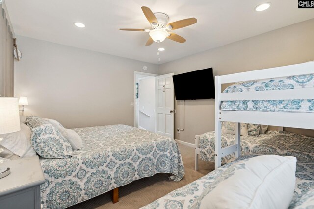 carpeted bedroom featuring ceiling fan