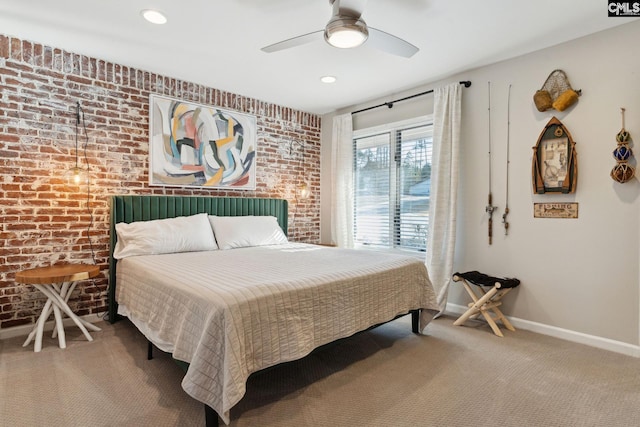 bedroom with brick wall, carpet, and ceiling fan