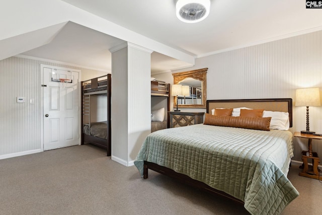 bedroom with ornamental molding and carpet