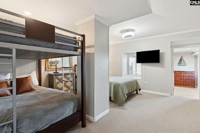 bedroom with ornamental molding and carpet