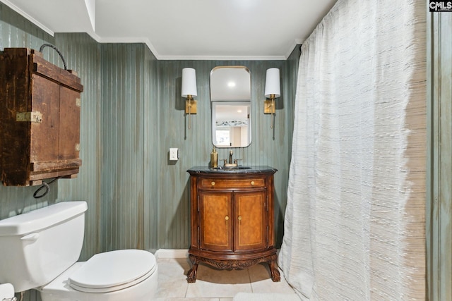 bathroom with vanity, tile patterned floors, ornamental molding, and toilet