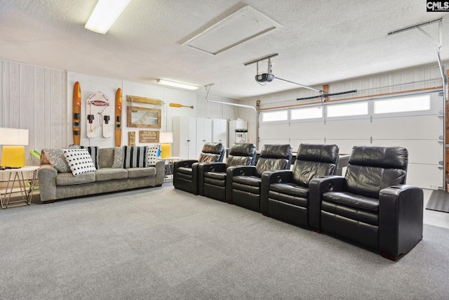 cinema with carpet and a textured ceiling