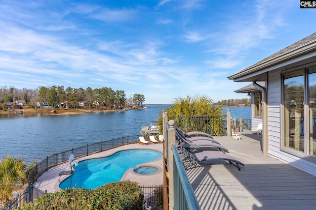 view of pool featuring a deck with water view