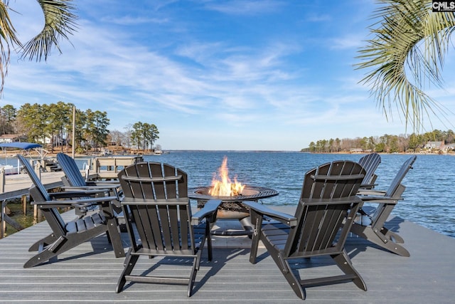 dock area featuring a water view and a fire pit