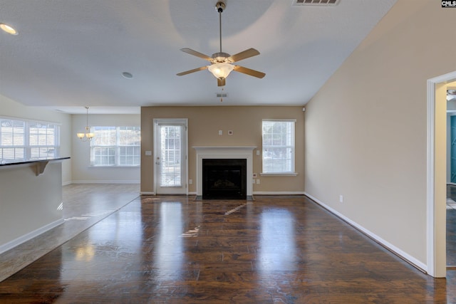 unfurnished living room with dark wood-type flooring and ceiling fan